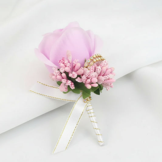 Artificial floral wedding buttonhole with ribbon finish