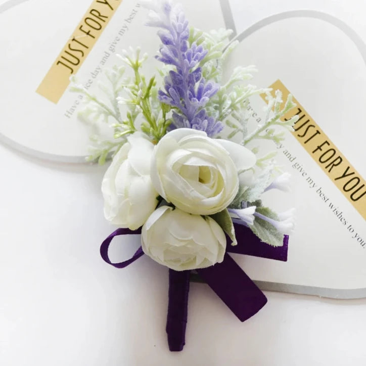 Artificial floral wedding buttonhole with ribbon finish