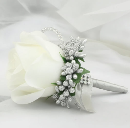 Artificial floral wedding buttonhole with ribbon finish