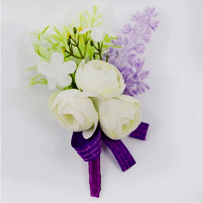 Artificial floral wedding buttonhole with ribbon finish