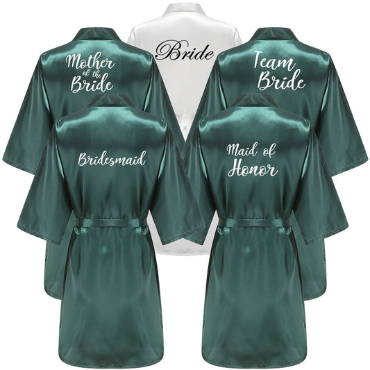 Emerald green bridal robes with “Bride” "Bridesmaid" "team bride" and "Mother of the bride" title on back