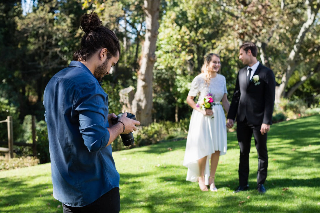 Bride and Groom having their photograph taken by a wedding photographer