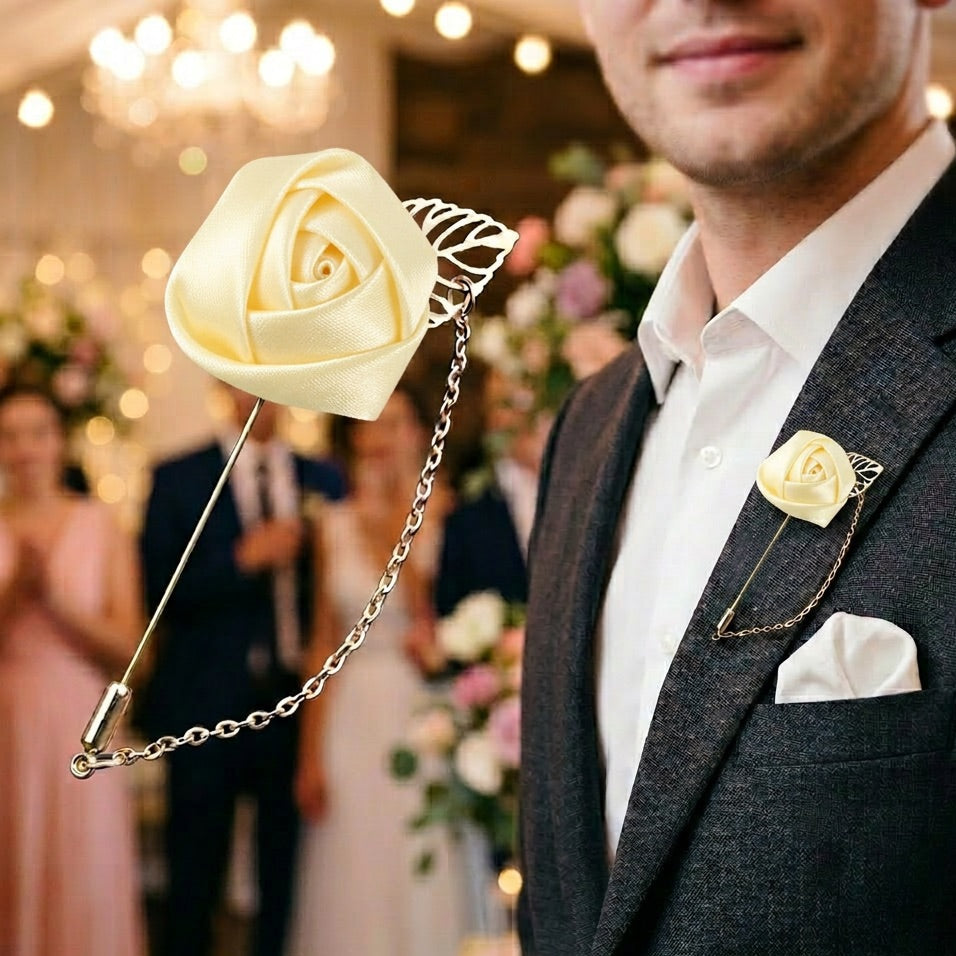 Man in a suit with a decorative yellow rose lapel pin at a formal event.