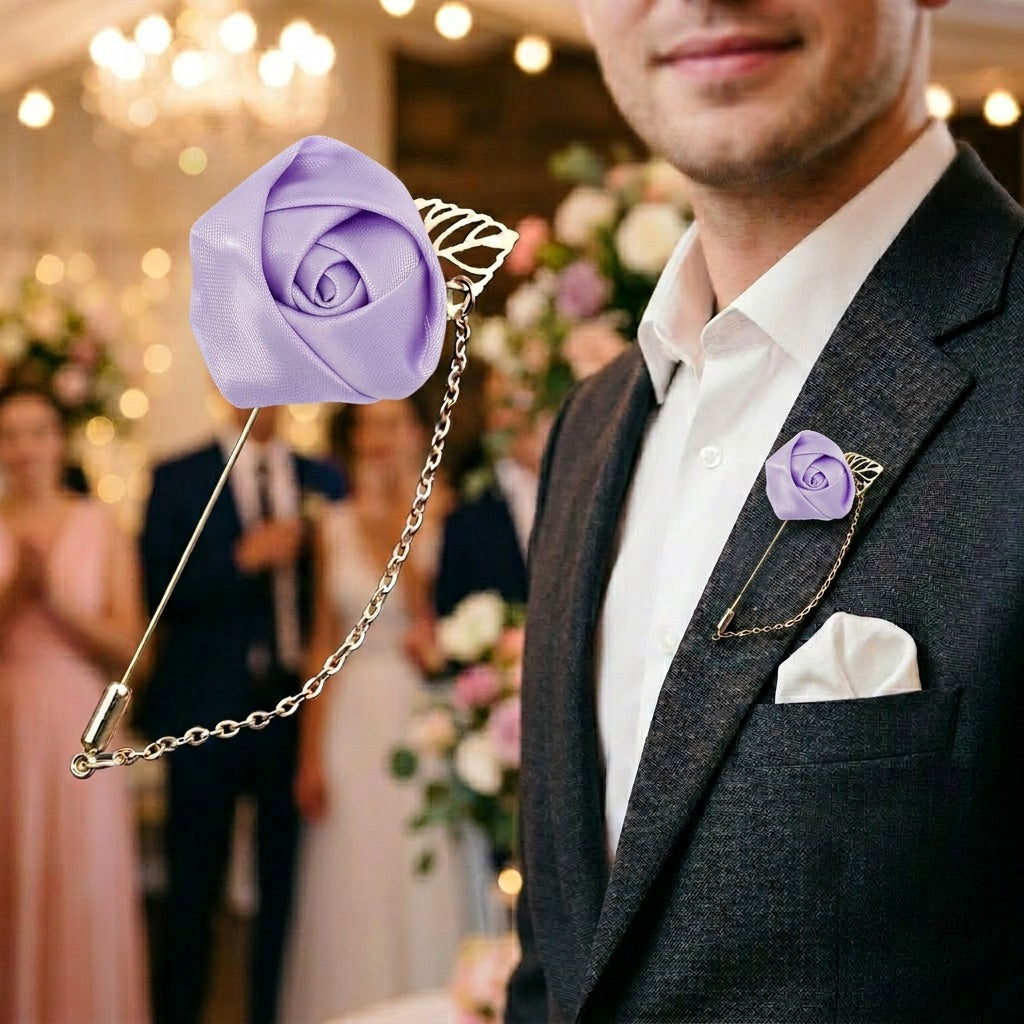 Man wearing a black suit with a purple rose lapel pin in a festive indoor setting.