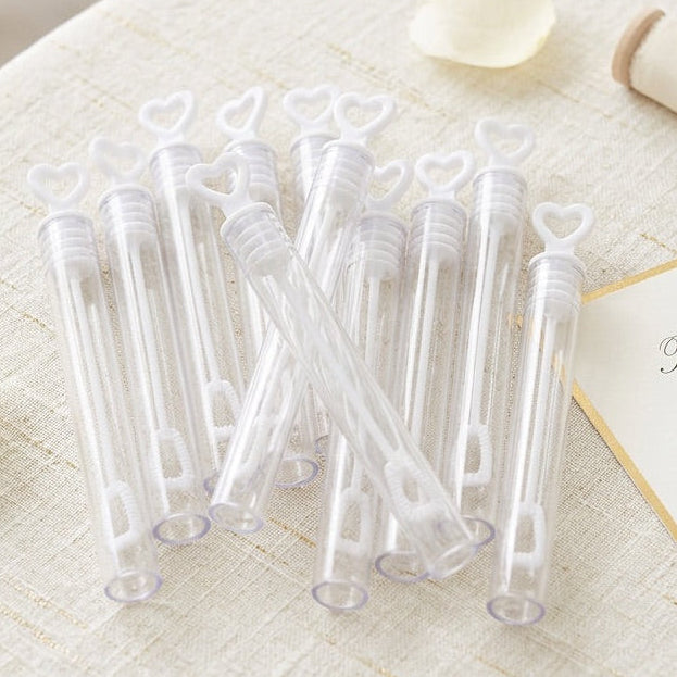 Clear plastic bubble tubes on a round table with decorative elements