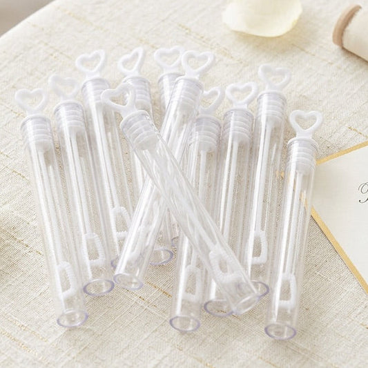 Clear plastic bubble tubes on a round table with decorative elements
