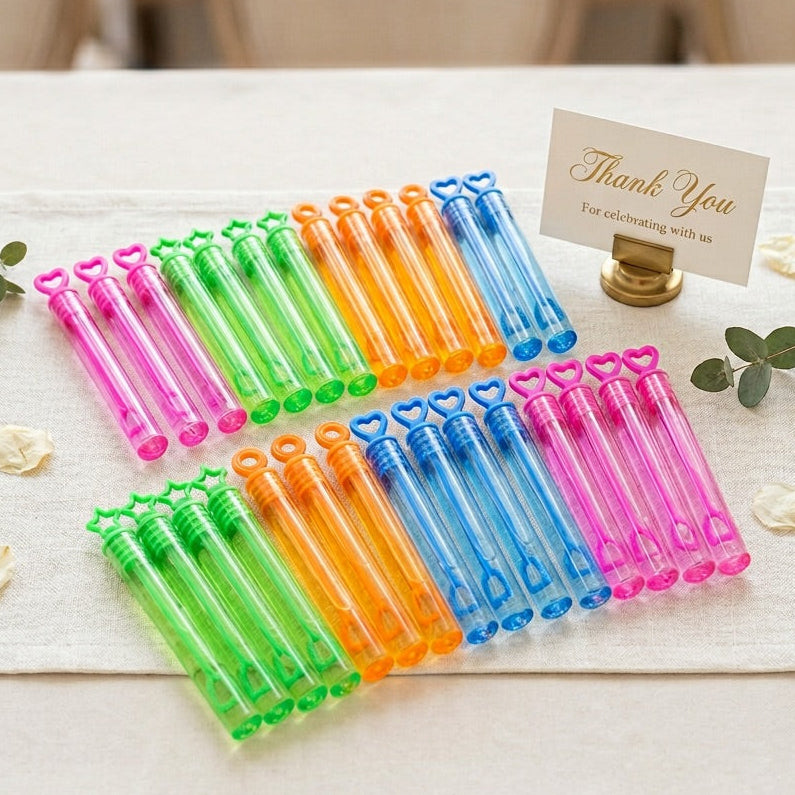Colorful bubble wands on a table with a 'Thank You' card.