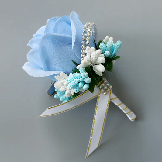Artificial floral wedding buttonhole with ribbon finish