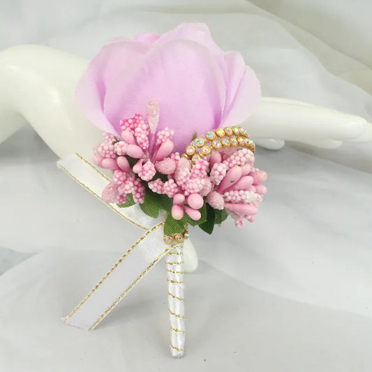 Artificial floral wedding buttonhole with ribbon finish