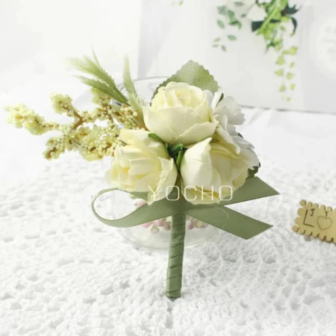 Artificial floral wedding buttonhole with ribbon for groom or groomsmen