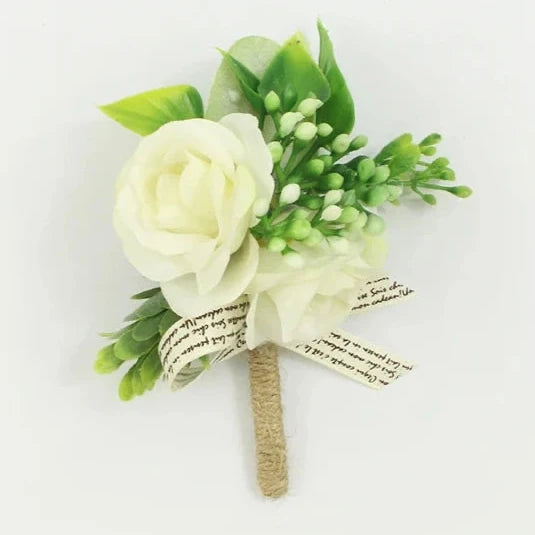 White artificial floral wedding buttonhole with ribbon finish