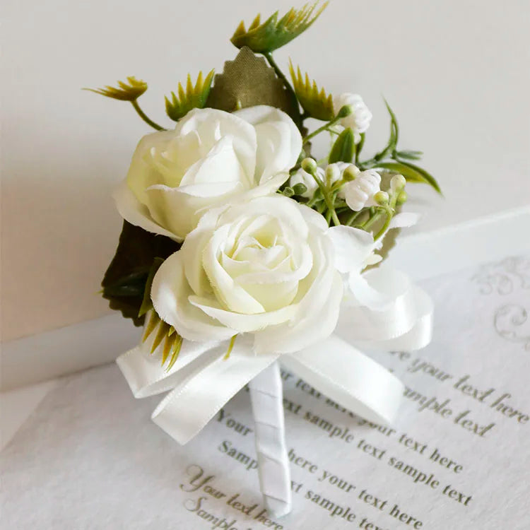 Artificial floral wedding buttonhole with ribbon finish