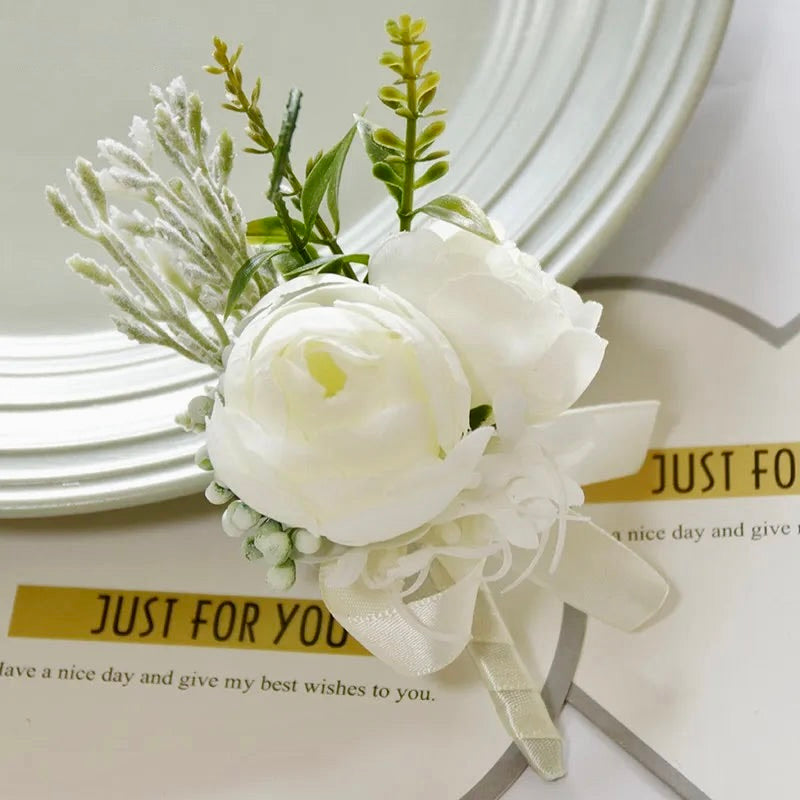 Artificial floral wedding buttonhole with ribbon finish