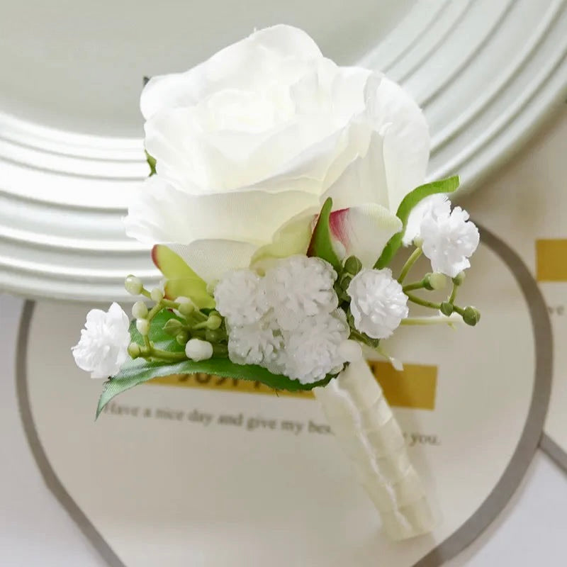 Artificial floral wedding buttonhole with ribbon finish