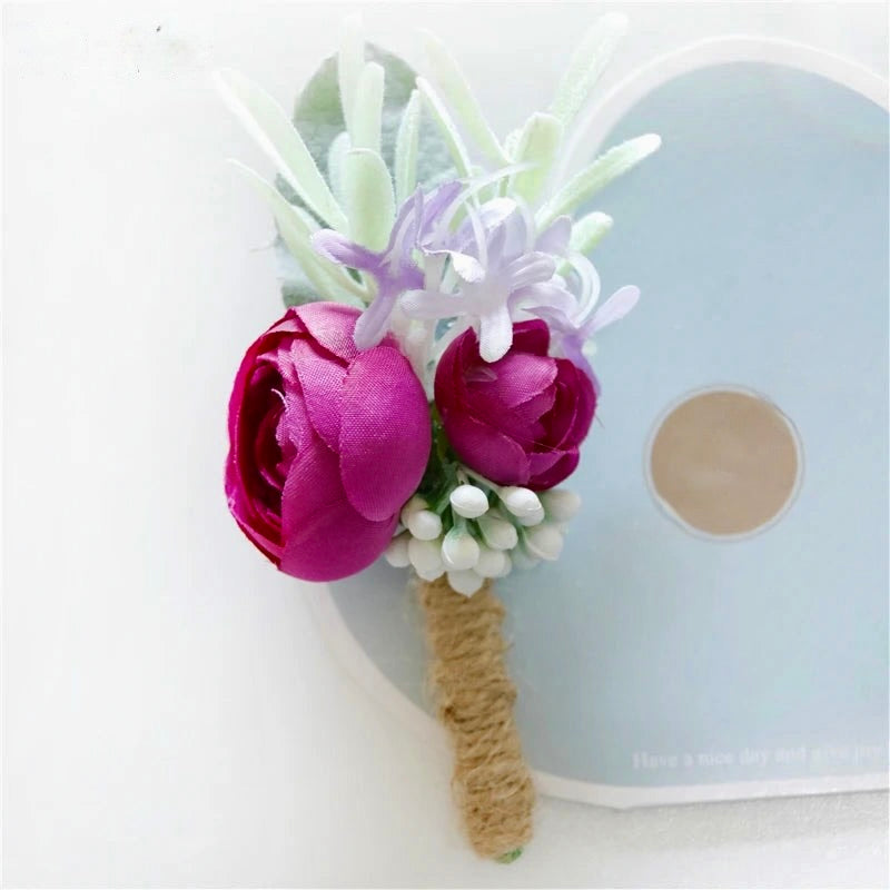 Artificial floral wedding buttonhole with ribbon finish