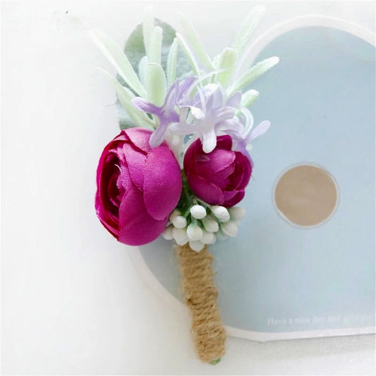 Artificial floral wedding buttonhole with ribbon finish