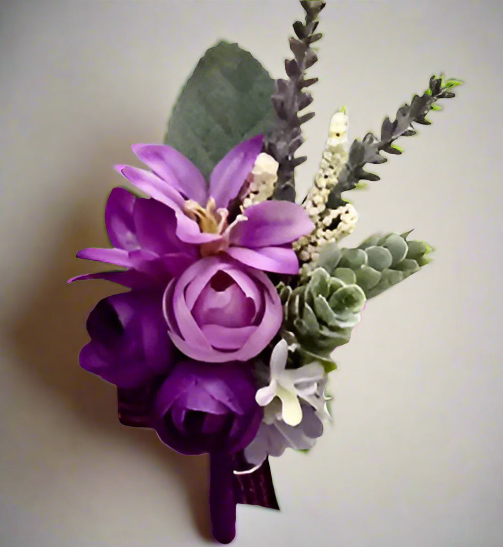 Artificial floral wedding buttonhole with ribbon finish
