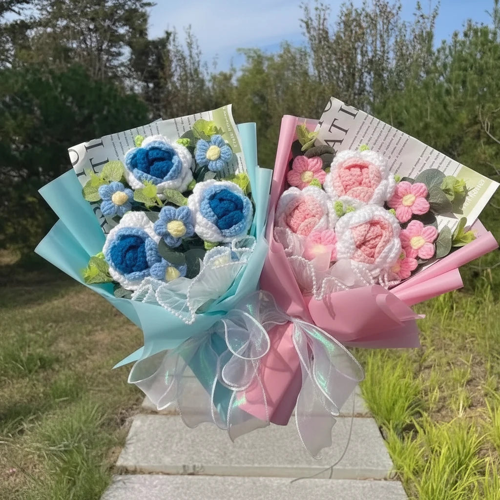 Bouquets of blue and pink crocheted flowers outdoors.