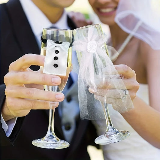 Bride and groom champagne glass decorations with tuxedo and veil accessories