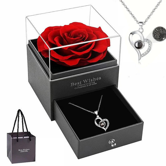 Heart-shaped lens necklace with secret “I love you” message in gift box with red rose