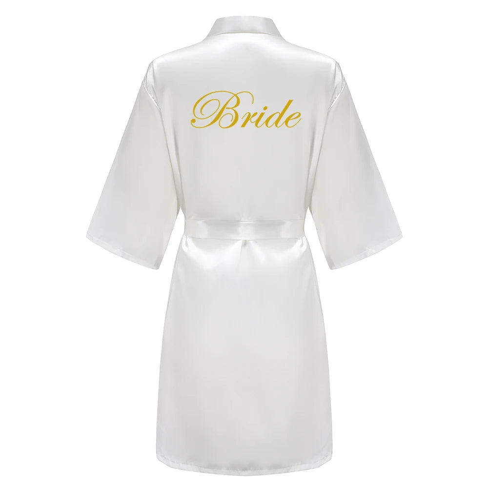 White satin robe with 'Bride' embroidered on the back against a white background