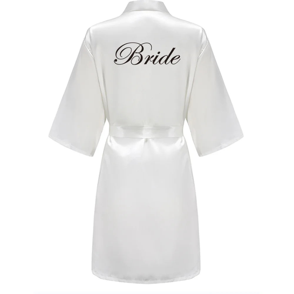 White satin robe with 'Bride' text on a white background