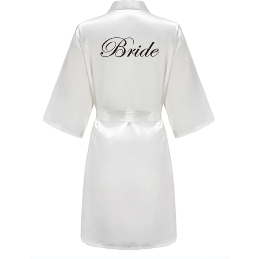 White satin robe with 'Bride' text on a white background