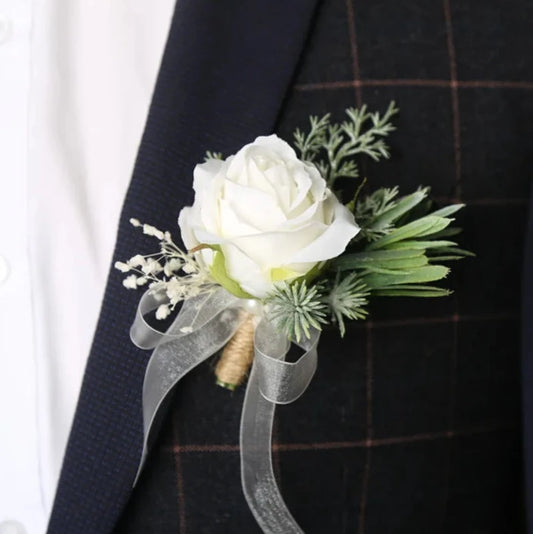Artificial floral wedding buttonhole with ribbon finish