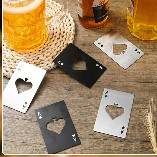 Set of card-shaped bottle openers on a wooden surface with beer glasses and bottles.