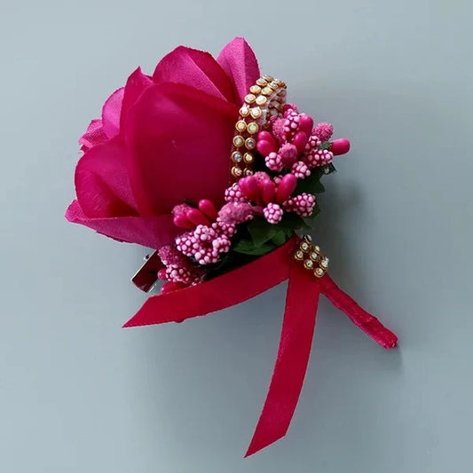 Artificial floral wedding buttonhole with ribbon finish