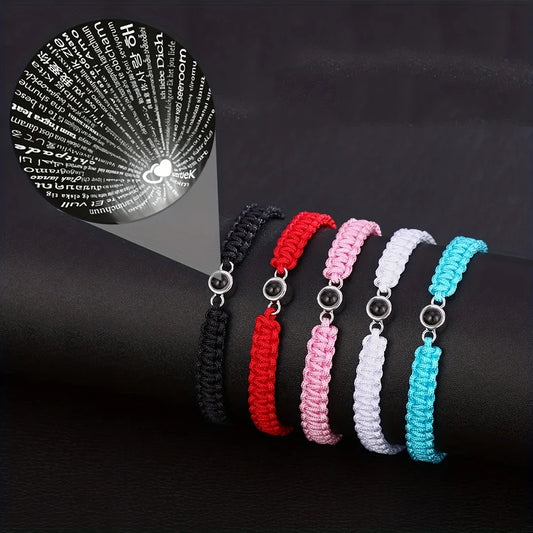 Love You in 100 Languages bracelet – projection jewellery gifts, available with  black, red, pink, white or teal cord.