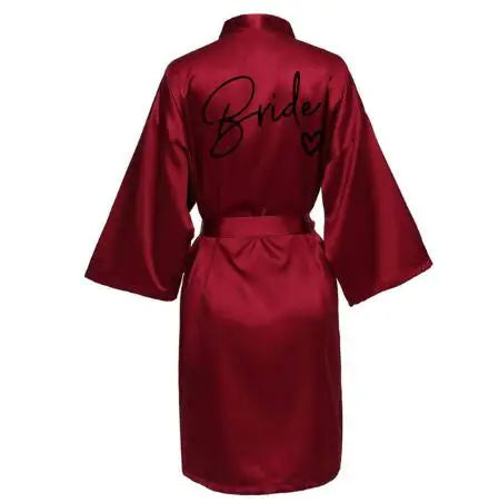 Dark red wedding party robe with “Bride” title on back