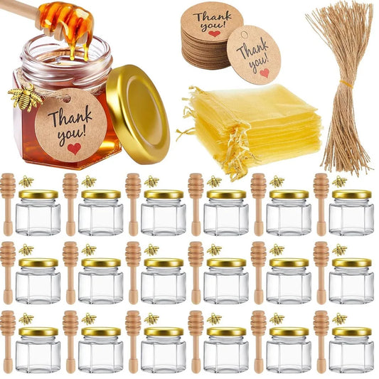 Mini honey jars with wooden dippers and gold gift bags – wedding favours
