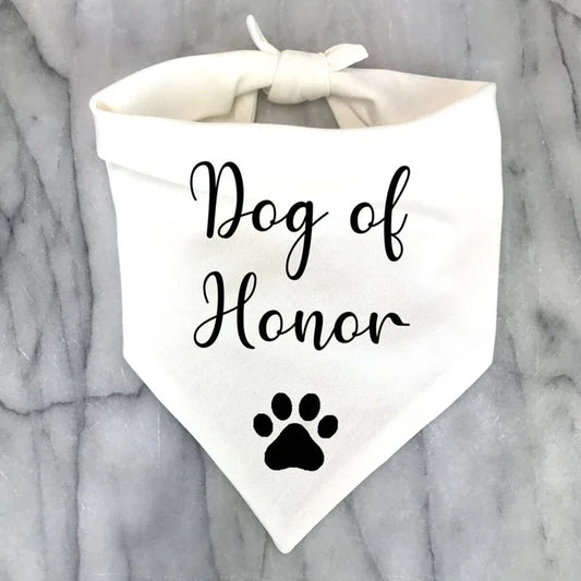 White bandana for dog, says "Dog of honour" on it.