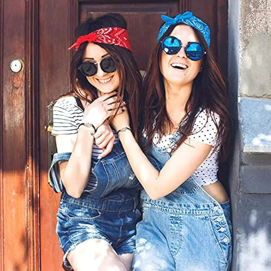 Two female friends wearing black and silver matching Handcuff Friendship Bracelets.
