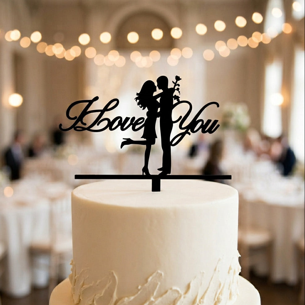 White wedding cake with 'Mr and Mrs' topper in a festive indoor setting