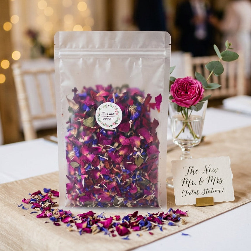 Bag of colorful dried petals on a table with a blurred background