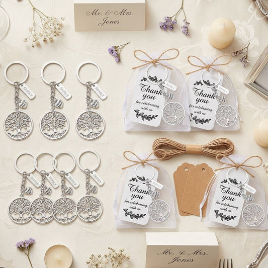 Table setting with silver keychains, 'thank you' tags, and decorative elements on a light surface.
